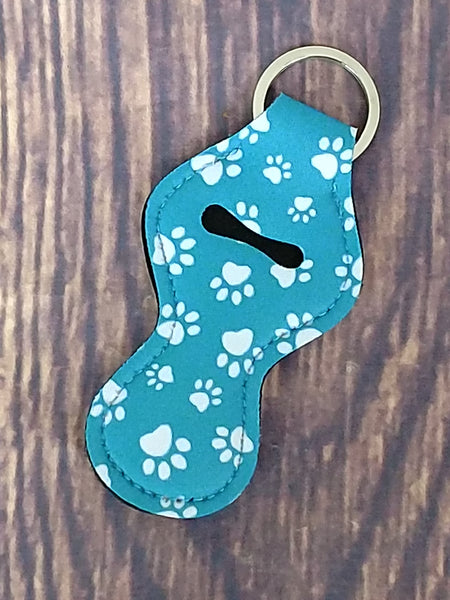 White Paws on Teal Background Chapstick Holder